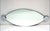 Cristal Art mirror designed by Giuseppe Raimondi, 1970s. Oval wall mirror with chrome-plated steel end caps and a front...