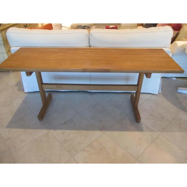 Vintage wood butcher block console with rounded edges and a natural finish. Top measures 1.5" thick.