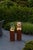 Stylish column light for outdoor use. The luminaire is filled with glass chunks and is illuminated from below with a 5...