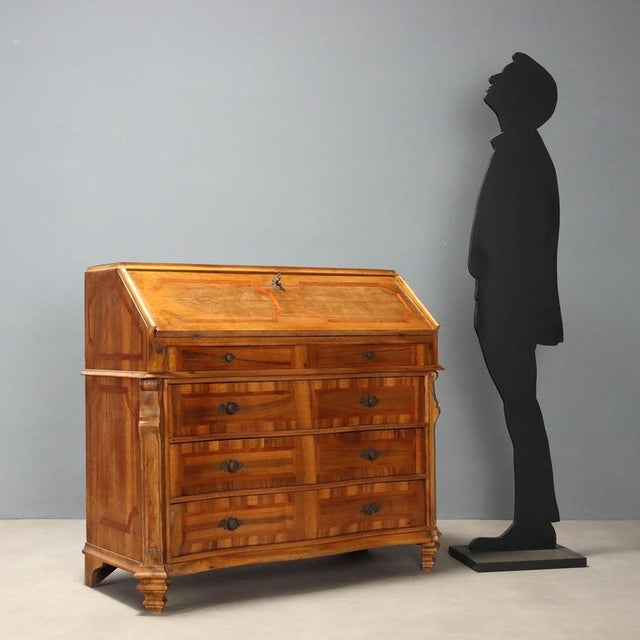 Early 20th-century style bureau crafted from fine walnut wood with elegant cherry inlays. The slightly curved front adds...