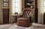 A richly patinated vintage leather swivel lounge chair combining deep comfort with a distinctive sculptural silhouette....