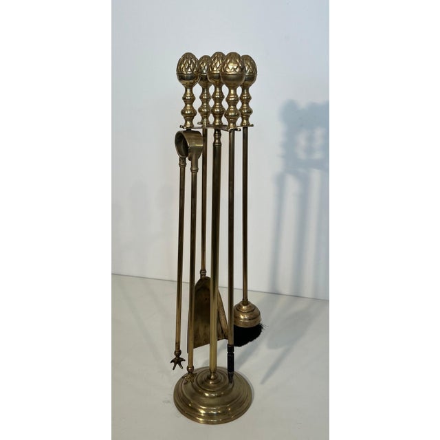 This beautiful neoclassical-style pineapple-shaped fireplace tool is made of brass. It is a French work in the style of...