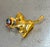 1960s-70s gold tone enameled cat w/ yarn ball brooch. Excellent condition.