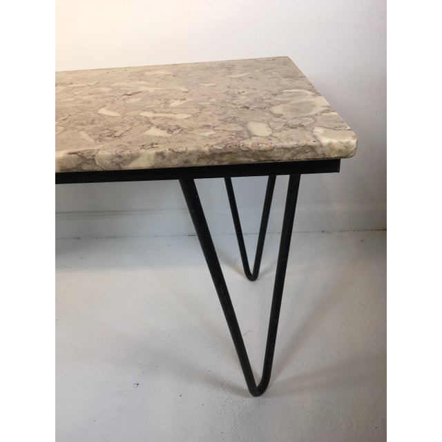 Mid 20th century marble top coffee table paired with classic hairpin wrought iron legs. Please note the marble top is very...