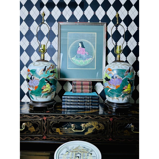 Pair of large Japanese porcelain table lamps featuring hand-painted figural decoration depicting court ladies in a...
