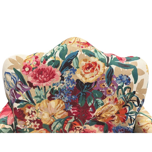 Here is a lovely, camel back Queen Anne style love seat with linen upholstery fabric. It has a beautiful floral pattern...