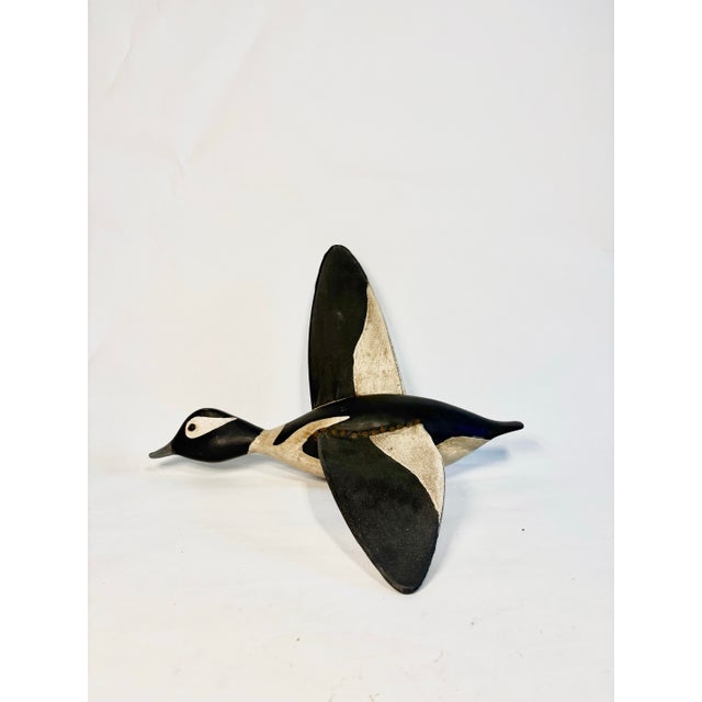 Striking vintage duck sculpture carved from wood with painted canvas wings. Sleek, low-profile with smooth, sculptural...
