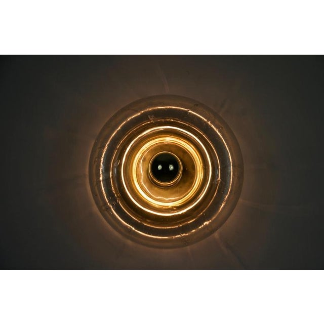 This striking mid-century wall lamp was designed and produced by doria leuchten in germany during the 1960s. The lamp...