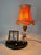 An elegant and decorative french table lamp with a built-in clock, dating from the art deco period, circa the 1930s. the...