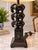 Striking vintage table lamp featuring a sculptural trio of elephants in a stacked design, finished in black with warm gold...