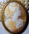 An elegant Victorian hand-carved cameo brooch, dating from the late 19th to the early 20th century, featuring a...