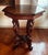 Antique 1920’s American carved mahogany, figural storks on rams heads with octagonal top, lamp / side table. Features four...