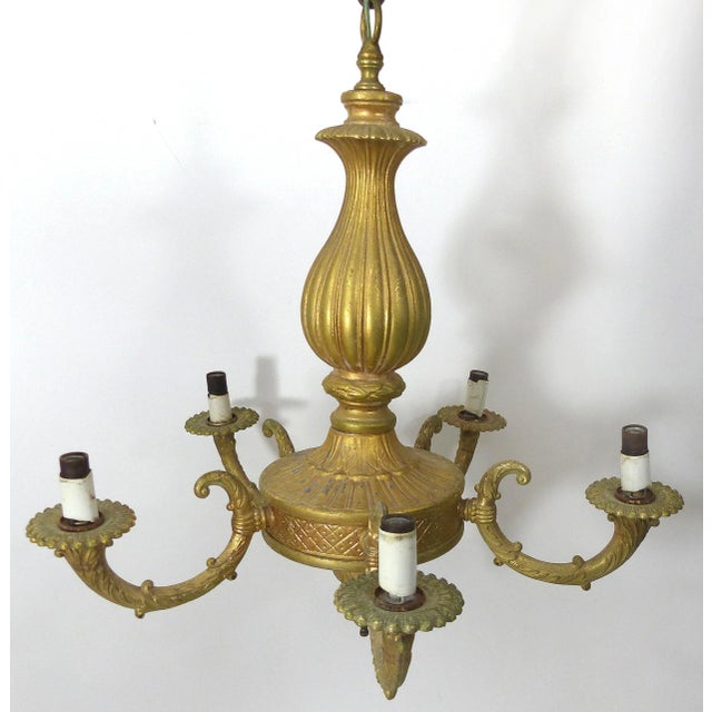 This is beautiful vintage gold - finished 5-socket metal chandelier. It takes up to 70 Watt bulbs. The chandelier comes...