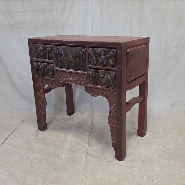 A beautiful and unique antique Chinese Qing dynasty deep red lacquer side table or ladies' desk, dating from the late...