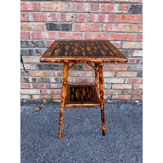 This is a beautifully decoupage English bamboo side table with a fish motif. The antique yellow against the black...