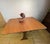 A beautifully designed mid-century teak drop leaf dining table by g plan, dating from the 1960s. This practical and...