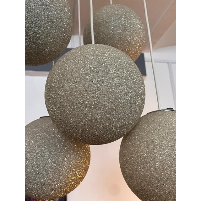 Mid-Century cascade lamp made of teak & granulate balls, 1970s 6-armed H: 130 cm DM: 40 cm or ball approx. 18 cm Good...