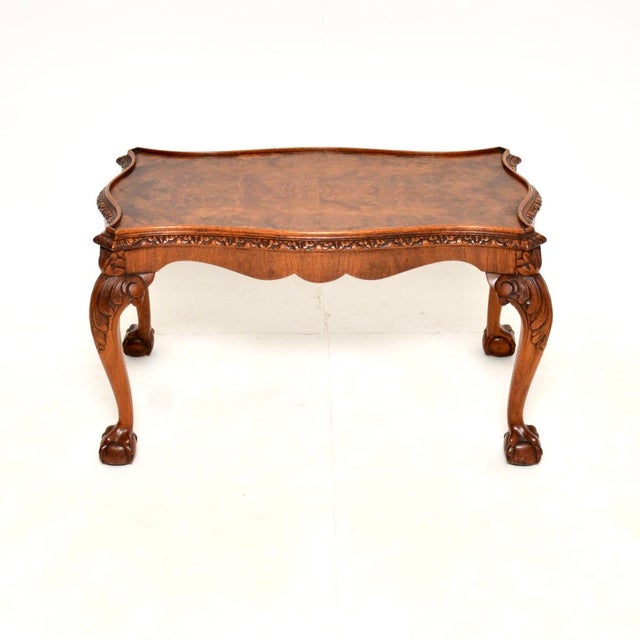 A stunning antique Queen Anne style burr walnut coffee table. This was made in England, it dates from the 1920’s. It is of...