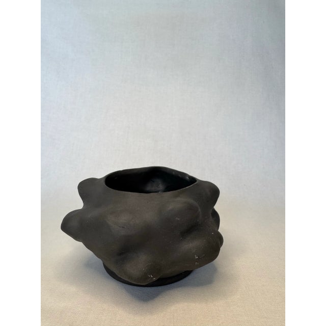 The studio art pottery planter has an abstract modern shape and is adorned with soft protrusions throughout it's squatty...
