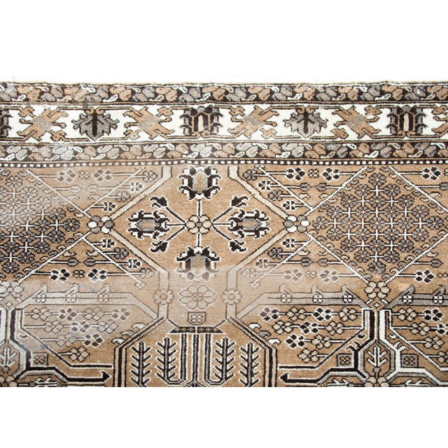 A wonderful vintage Persian Bakhtiari rug with a wonderful geometric patchwork pattern of myriad flowers and vines...