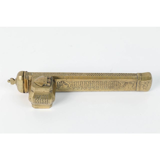 19th Century Islamic Brass Qalamdan Inkwell with Calligraphy, Persia/Turkey A finely crafted 19th-century Islamic qalamdan...