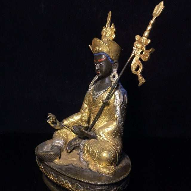 This is a finely crafted gilt bronze sculpture of Padmasambhava (also known as Guru Rinpoche), the revered 8th-century...