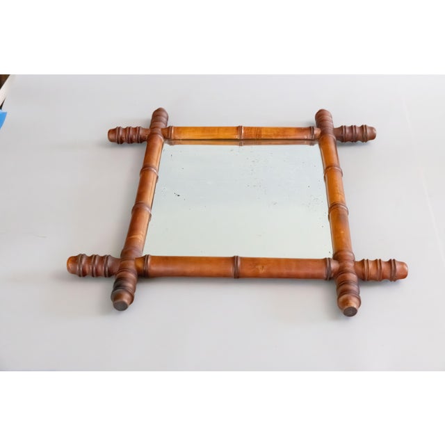 A superb antique French mirror hand carved to resemble bamboo, circa 1900. It retains the original glass and the wood has...