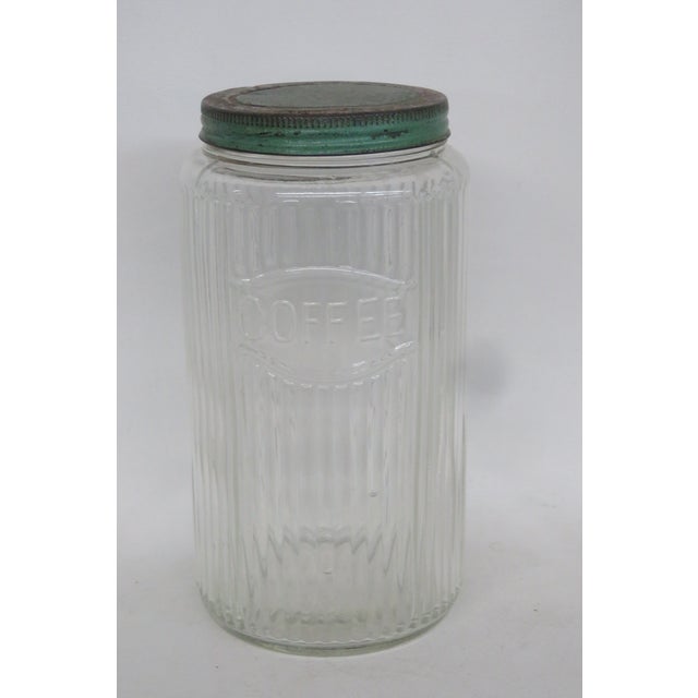This beautiful Coffee Canister / Kitchen Jar is made out of ribbed glass and comes with a screw-on metal lid. This...