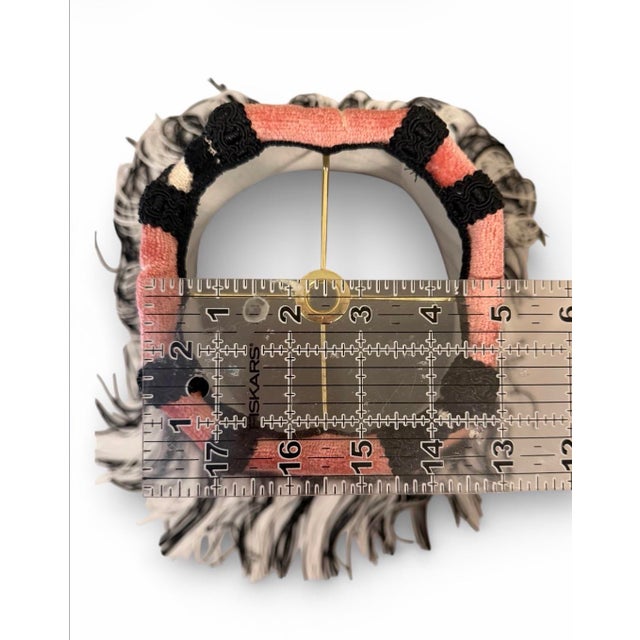 A striking decorative lampshade featuring a bold zebra motif rendered in plush velvet against a rich coral-rose ground....