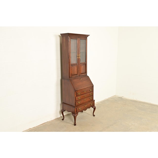 A beautiful Georgian or Queen Anne style bureau with drop front secretary desk and bookcase hutch top By Ethan Allen USA,...