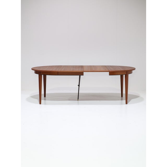 Beautiful extendable 'model 55' dining table produced by Omann Jun in Denmark, 1960s. This dining table is made of teak...