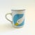 A vintage ceramic lidded mug, decorated with a goose design in blue, white and yellow glazes. Includes and interior...