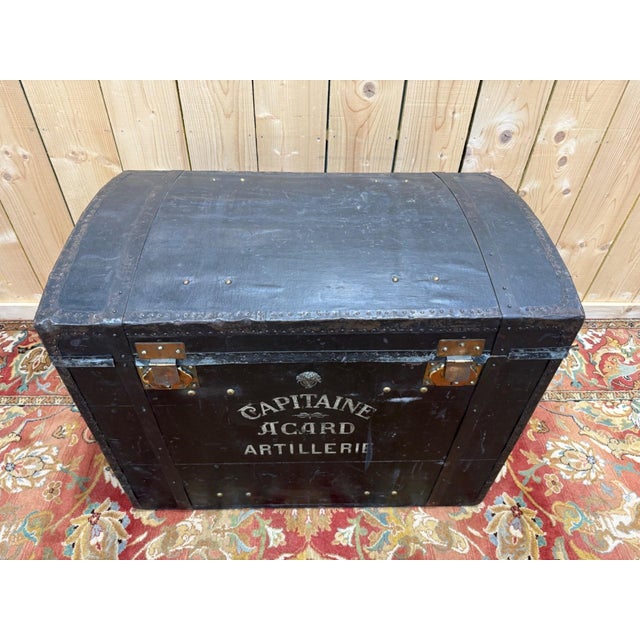 Military travel trunk with a domed lid, 19th century, identified by a stenciled inscription in white letters: "Captain...