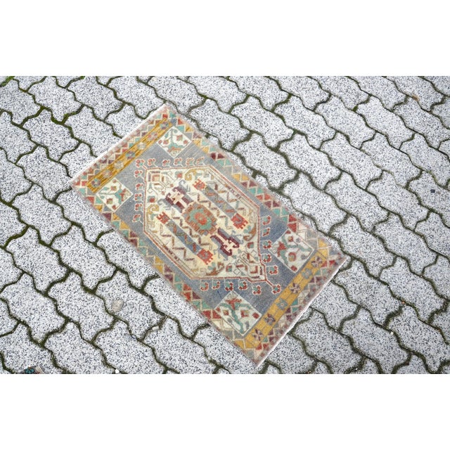 This is a vintage Turkish Oushak rug from the 1960s. The piece was hand-knotted.