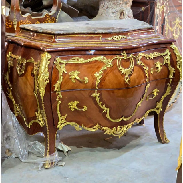 Experience the grandeur of European craftsmanship with this magnificent French Rococo-inspired dresser, masterfully...