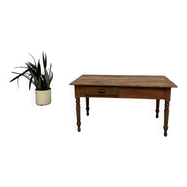 Maison Lecan presents this 1950s farmhouse work table in solid pine. Its compact size (160 x 80 cm) features two large...