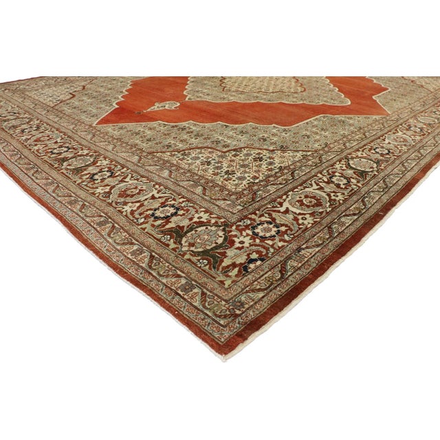 Haji Khalili Antique Persian Tabriz Rug with English Tudor Manor House Style 10'02 x 13'03. With its warm earth-tone...