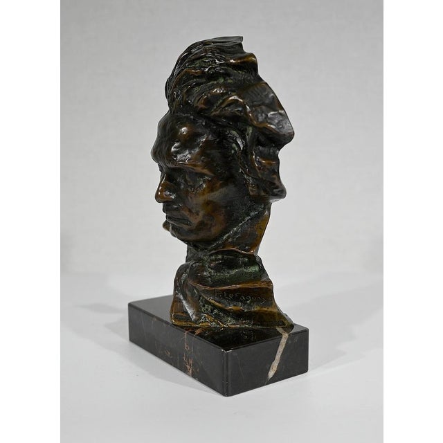 Subject in bronze with green patina produced by Pierre Le Faguays (1892-1962) and edited by Le Verrier, on a veined black...