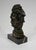 Subject in bronze with green patina produced by Pierre Le Faguays (1892-1962) and edited by Le Verrier, on a veined black...