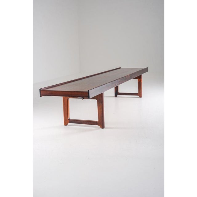 Iconic “Krobo” bench designed by Torbjørn Afdal, executed in richly grained rosewood. The design is architectural and...