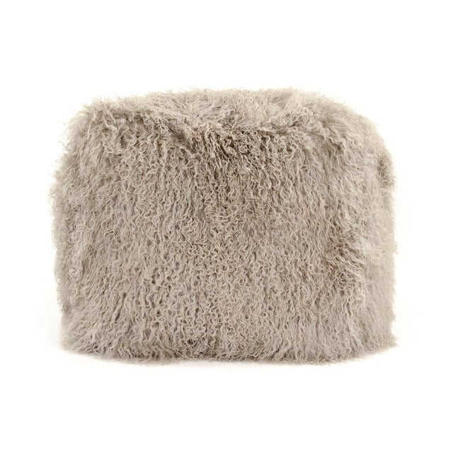 The 24" x 24" Tibetan Light Grey Lamb Fur Pouf from Zentique is a luxurious floor pouf covered in plush light grey Tibetan...
