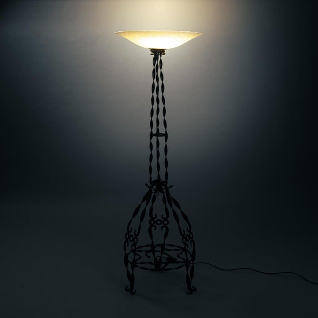 Beautiful floor lamp in wrought iron with clouded glass hood. measurements: h169 cm x w55 cm electricity was renewed. we...