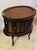 A beautifully crafted vintage mahogany oval bar cabinet that combines elegance, function, and timeless craftsmanship....