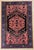 Antique hand-knotted rug from the Zanjan region in northwest Iran, featuring a large stepped central medallion set within...