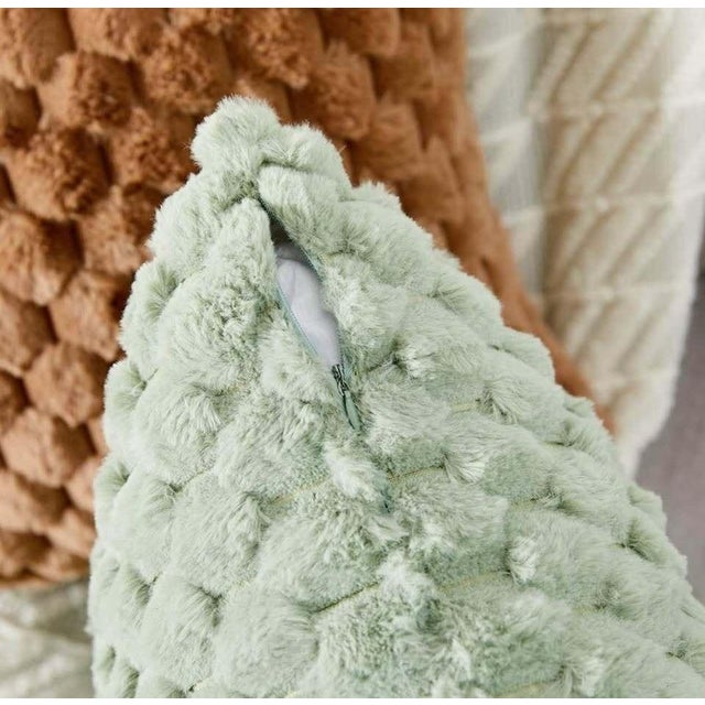 This decorative throw pillow features a soft, plush texture with a unique bubble-like pattern that adds a cozy and stylish...