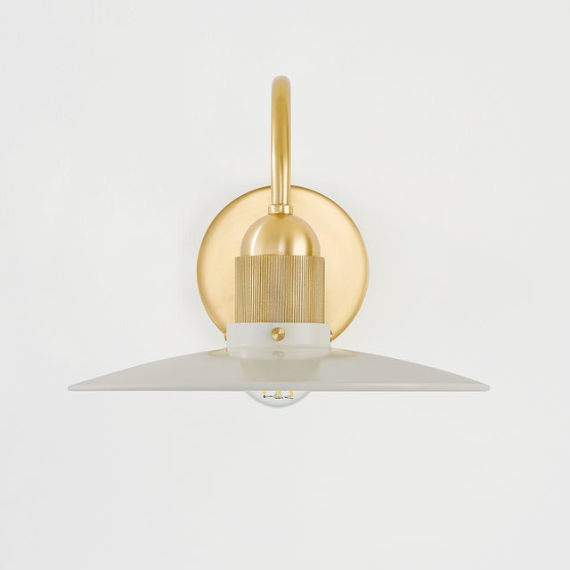 A beautifully modern take on the farmhouse pendant, Leanna features a very slim reflector shade in Soft Cream or Soft...