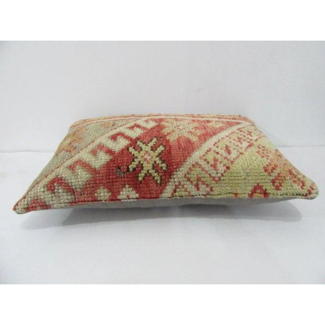 Decorative pillow cover made from a vintage Turkish handknotted rug. Backed with good quality cotton fabric. Pillow...