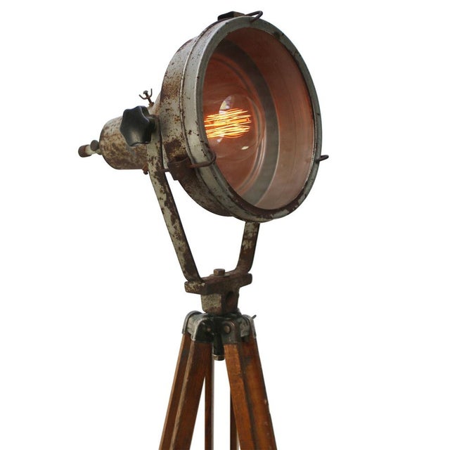 Vintage industrial spotlight on wooden tripod. adjustable height and angle. grey iron spot with clear glass. Diameter 30...