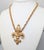 1970s goldtone molded fleur di lis pendant necklace with spring ring clasp. Marked "NAPIER©" on the back of the pendant....