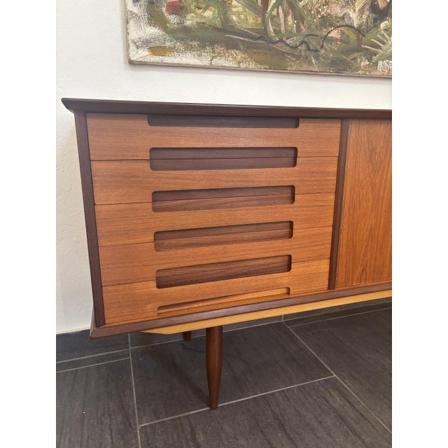 Mid-century teak sideboard by Johannes Andersen for Silkeborg Furniture Factory, 1960s Two doors with drawer on the left...